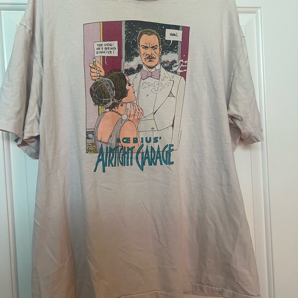 Hanes Beige Graphic Tee with Teal & Pink Comic Print fits like Men’s L